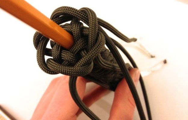 Fill the secret compartment | How To Make A Paracord Keychain