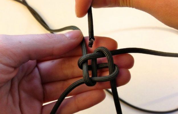 Take one end of P3 and insert it through the side of the knot | How To Make A Paracord Keychain 