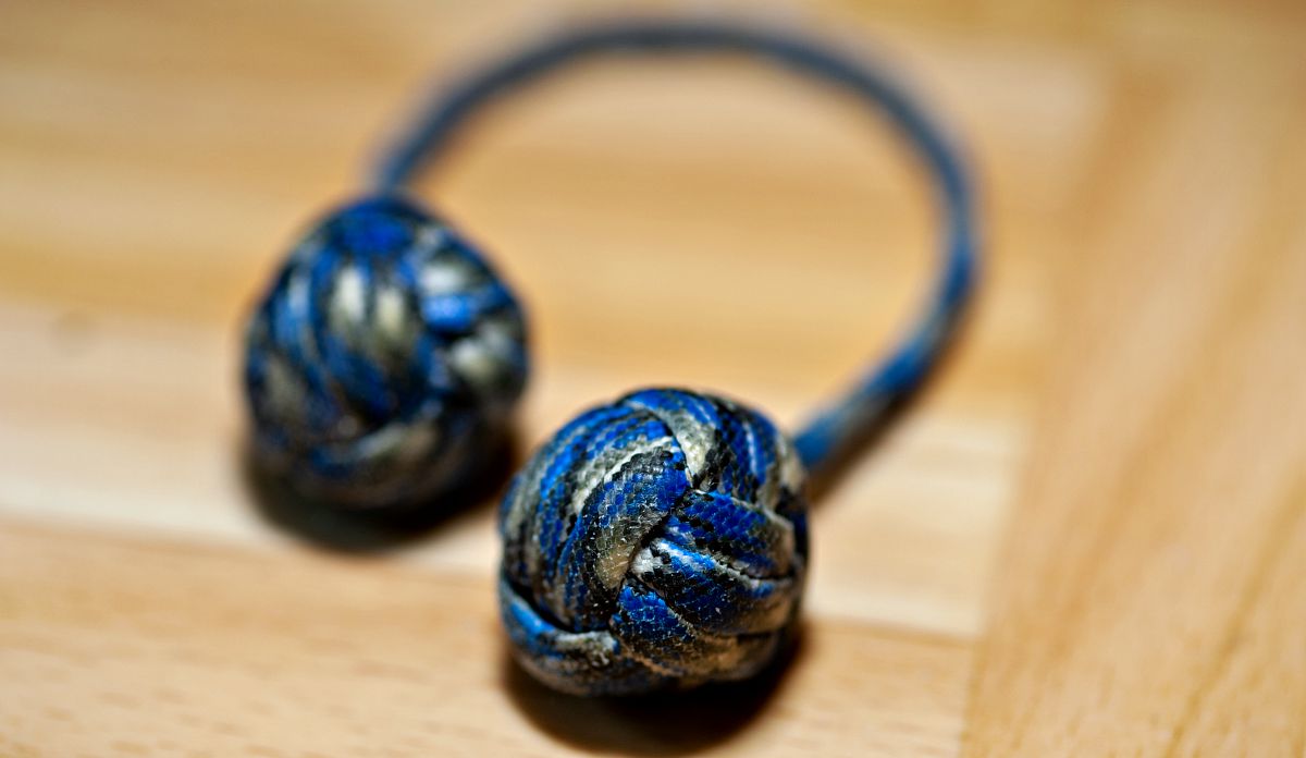 Closeup of a created of monkey's fists | How To Make A Giant Monkey Fist Paracord Project