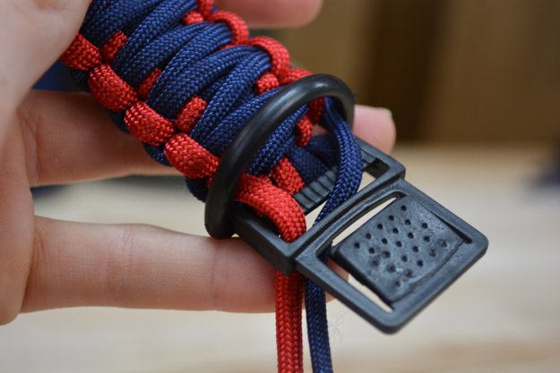 Pull the ends of the cord through the center of the D-ring | Learn To Make A Paracord Dog Collar | Instructions