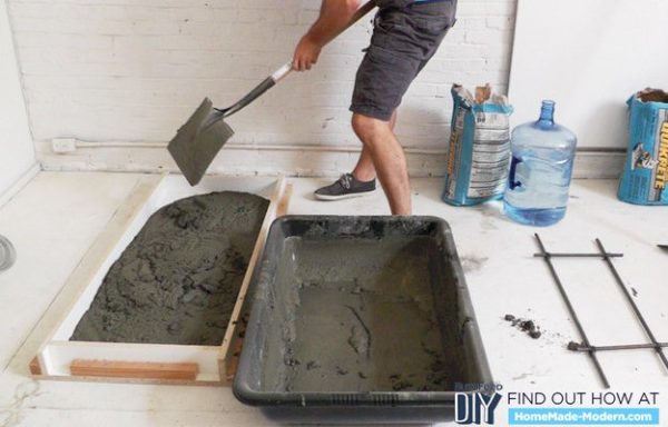 Use any color of cement mix for the kitchen island table.