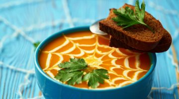 A healthy pumpkin puree garnished with cream and parsley leaves | Healthy Halloween Recipes | Easy Recipes For A Healthier Halloween | Featured