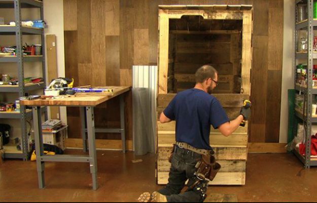 Continue attaching the pallet panels to the door | Smokehouse Build From Pallets | DIY Smoker For Less Than $100