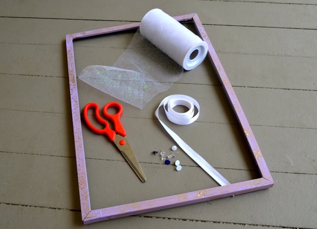 How to Make a DIY Jewelry Holder | https://diyprojects.com/tulle-frame-jewelry-holder/
