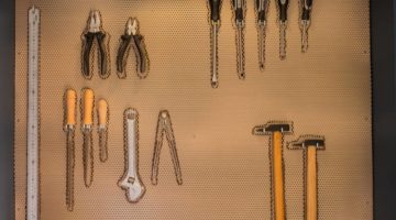 work-tools-hanging-on-wall-workshop | 11 DIY Tool Kits | Tool Organizer Ideas You Can Do at Home | Featured