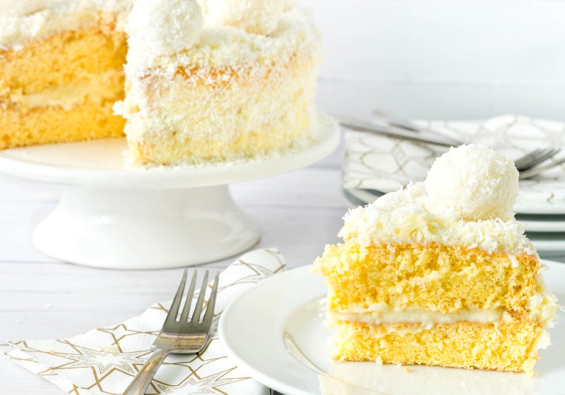 layered coconut sponge cake sliced served | vegan gluten free dessert