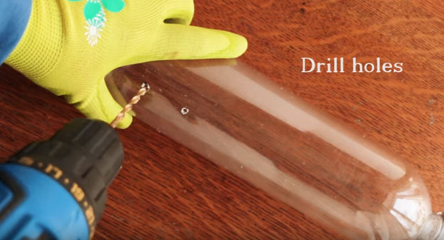 Drill holes on the water bottle | Complete This Easy DIY Bird Feeder In 7 Steps Or Less