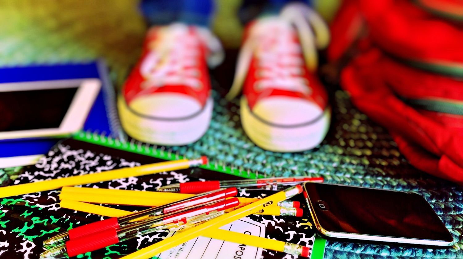 Close-up of multi colored pencils and a red converse sneakers | Money-Saving DIY Back To School Supplies | Featured