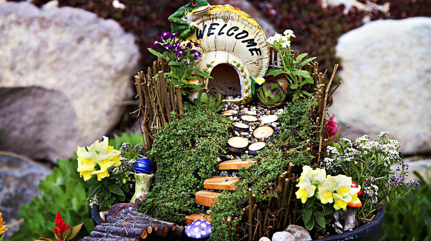 Featured | Fairy garden with a house made of a mushroom with a path and stairs in a flower pot | DIY Fairy Garden To Create A Little Zen In Your Busy Life