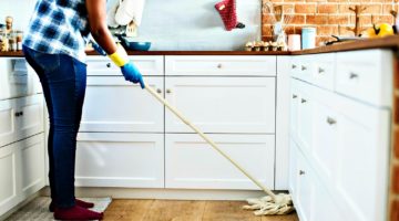 Feature | Person Using Mop on Floor | DIY Spring Cleaning Tips And Tricks