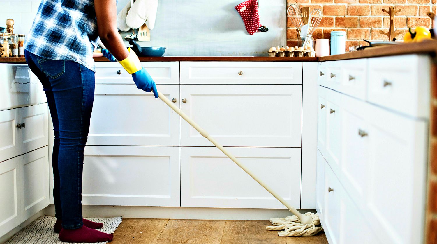 Feature | Person Using Mop on Floor | DIY Spring Cleaning Tips And Tricks