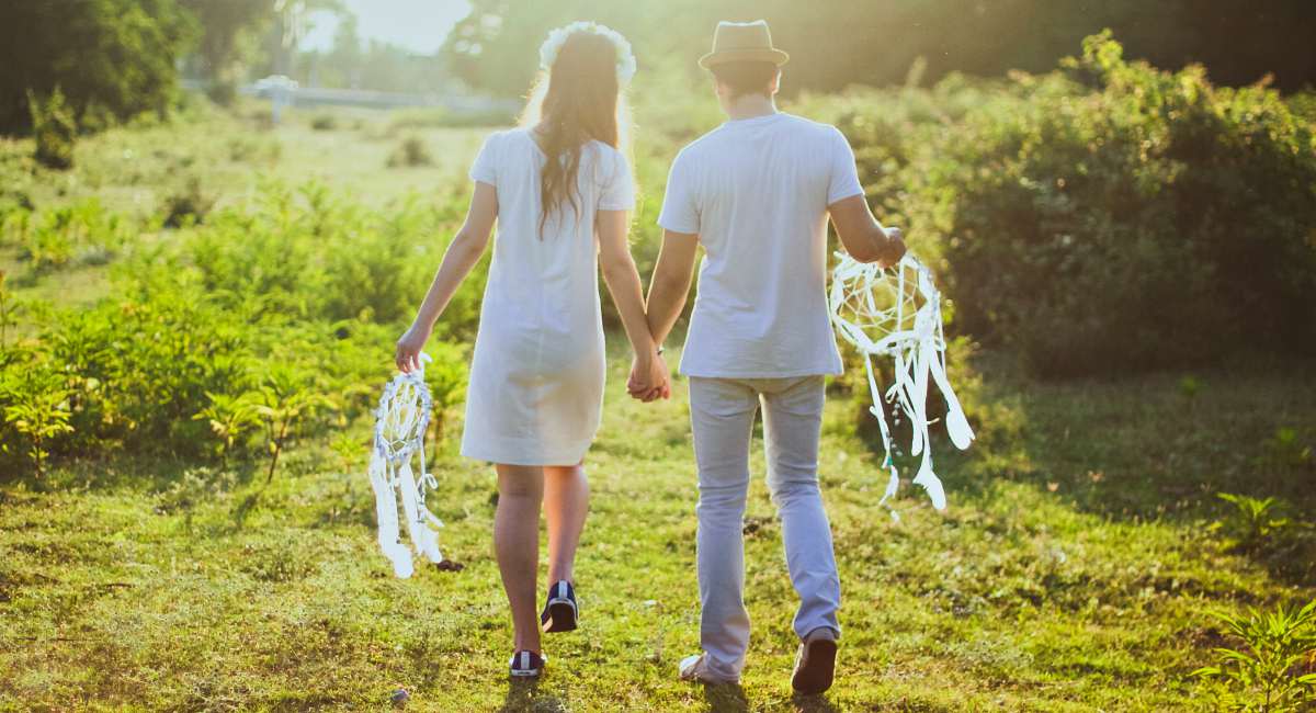 Couple holding white dream catcher | Fun Summer DIY Projects For The Whole Family