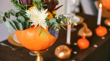 Autumn floral bouquet in a pumpkin vase for Halloween | Ways To Decorate Your Home With Pumpkins This Fall | decorating with pumpkins outside