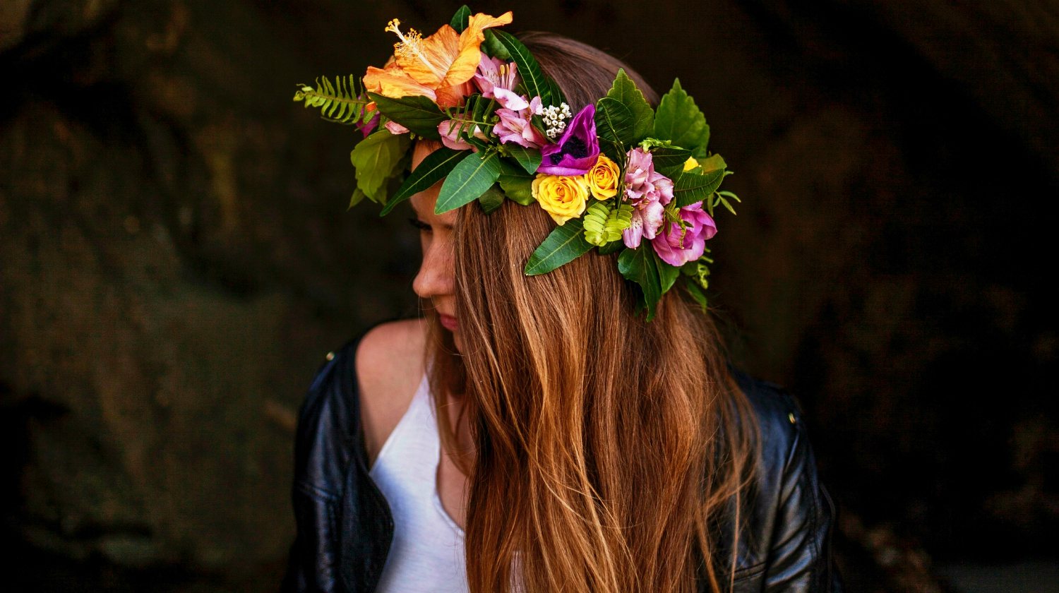 woman standing on dark area with flower crown | How to Make a Flower Crown | Pretty Flower Headbands