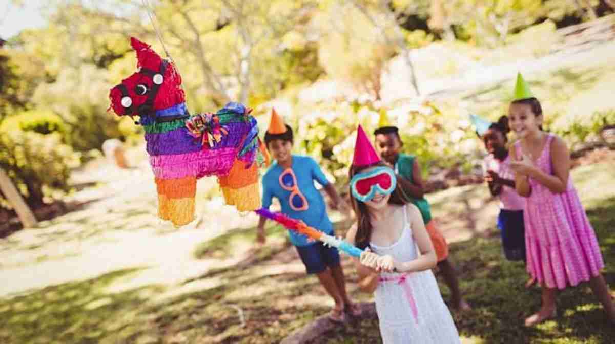 kids outdoor playing pinata | The Best Kids' Party Ideas For All Occasion