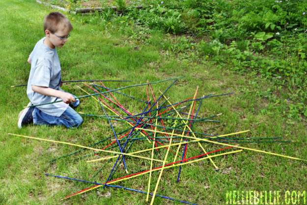 boy playing giant pick up sticks | The Best Kids' Party Ideas For All Occasion