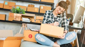 Featured | Young entrepreneur business owner work at home phone call receive from customer and white down address for deliver | College Care Package Ideas