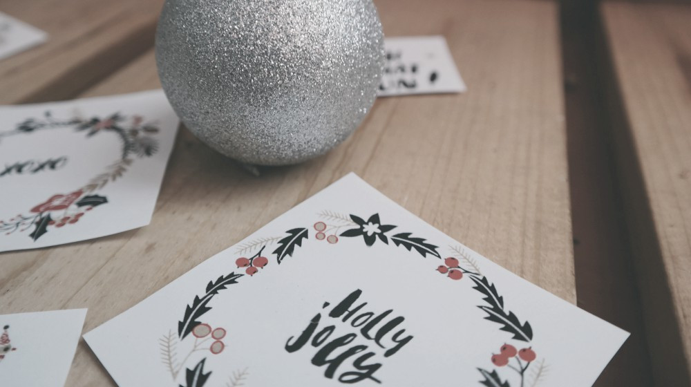 Closeup of handmade paper Christmas cards with calligraphy | Our DIY Christmas Ideas Roundup
