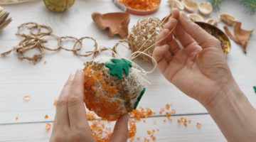 Person doing creative ornament diy | Stunning Homemade Christmas Ornaments You Can DIY On A Budget | unique‌ ‌handmade‌ ‌christmas‌ ‌ornaments‌ ‌| Featured