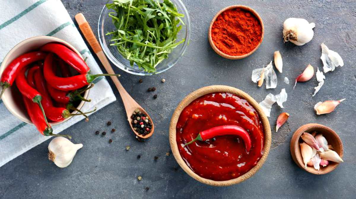 Chili sauce ingredients on grey table | Top (Delicious) Hot Sauce Recipes You Can Make