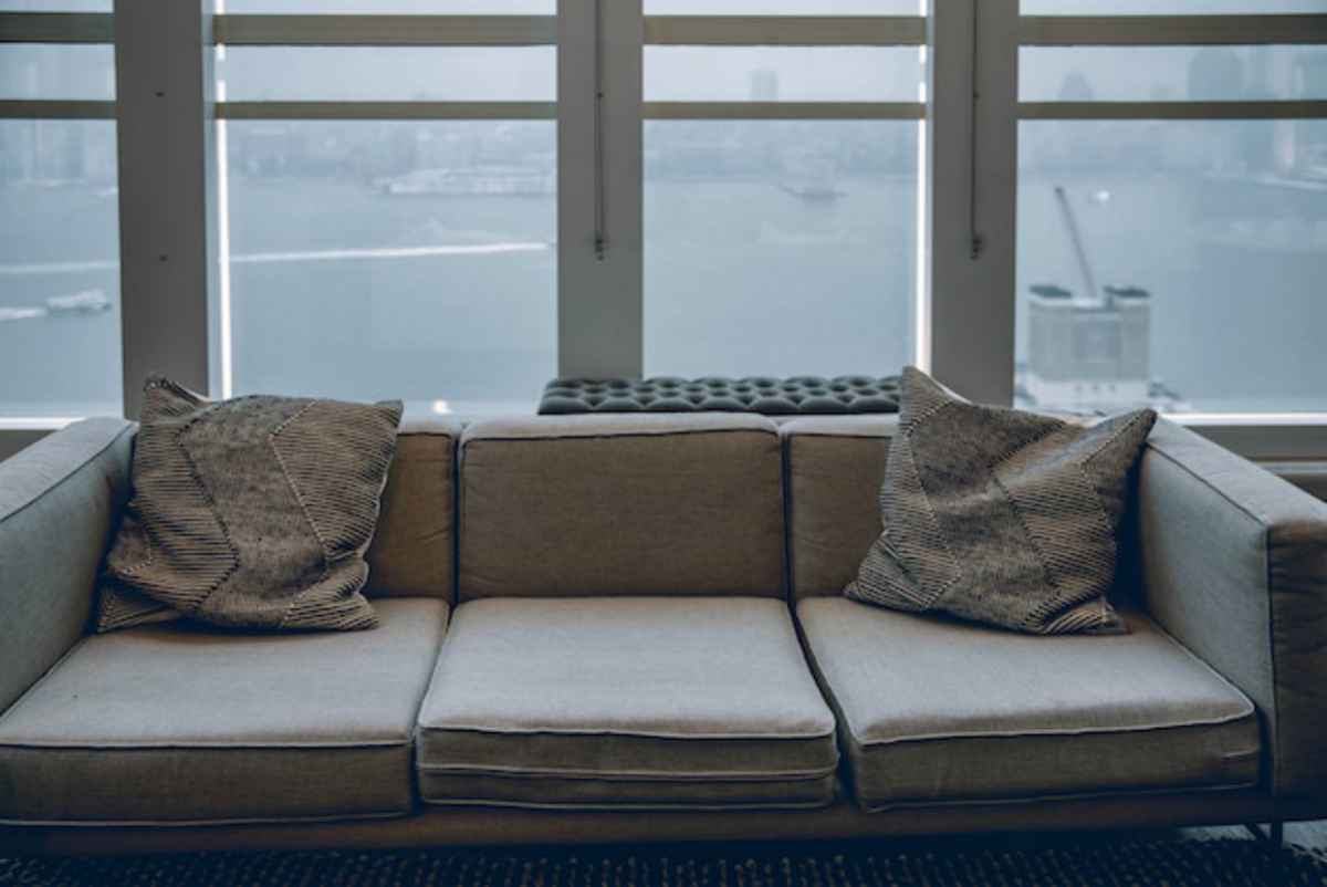 gray sofa by the window | Easy Home Improvement Projects: Small Budget, Big Impact Upgrades