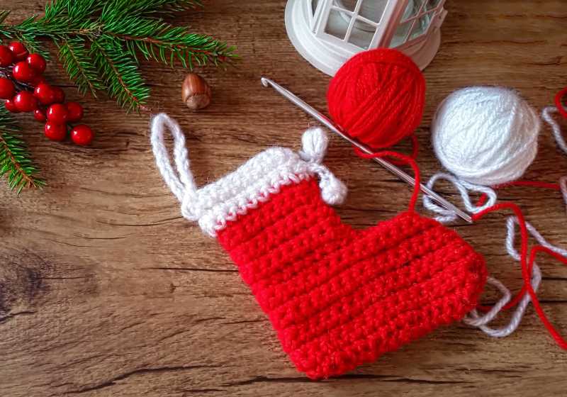 Knitted Christmas stocking and wool yarn balls | Jingle Bell Stocking