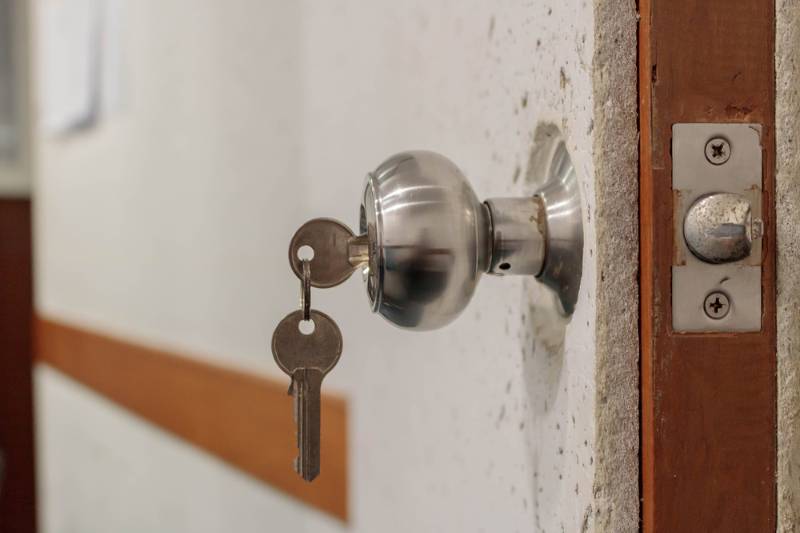 insert-key-into-lock-door-soundproofing | acoustic-panels-on-wall-form-honeycombs | diy soundproofing door
