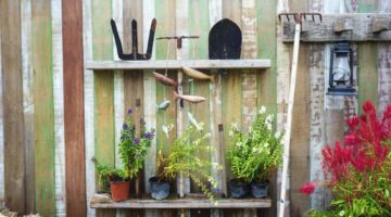 farm equipment on wooden wall with plants | Easy Lawn And Garden Tool Storage Pallet Project | How-To | Featured