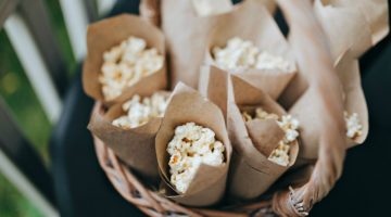 Crafting the package with popcorn lying in a wicker basket | DIY Gifts For Dad | Rustic Popcorn Sampler | Featured