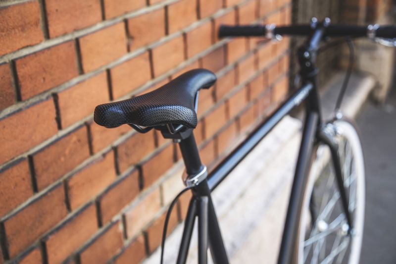 bike leaning on a brick wall | bike chain