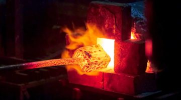 burning-blacksmith-forge-making-metal-items | Build A DIY Forge To Create Useful Items For Your Home | home forge | Featured
