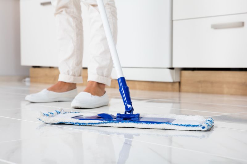 cleaning-service-woman-mopping-floor-kitchen | method cleaning products | homemade natural cleaning products