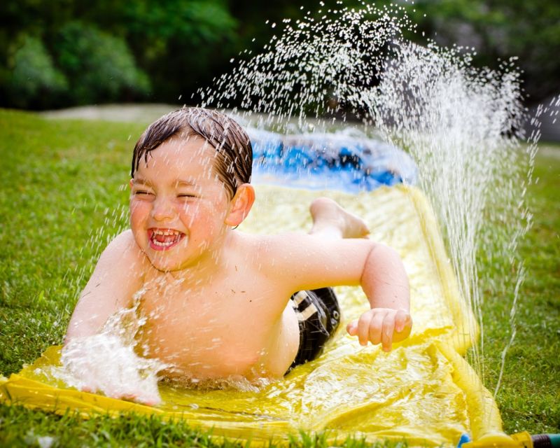 happy-child-on-water-slide-cool | outdoor diy projects for beginners