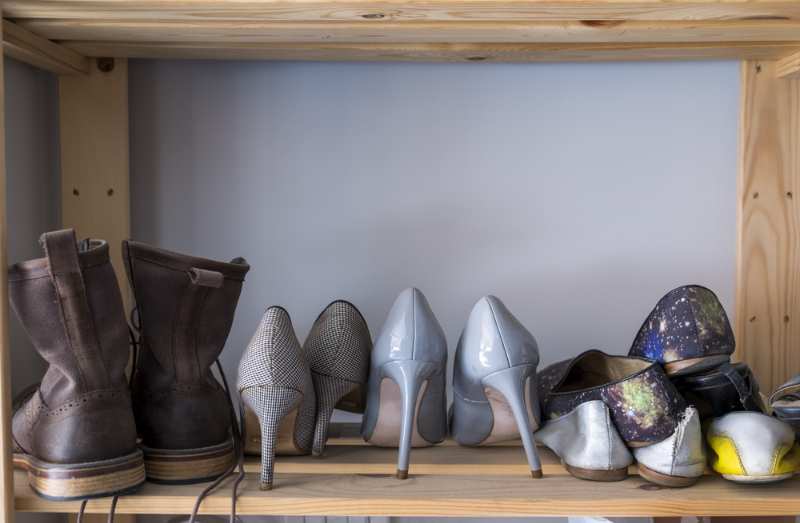 many pairs shoes on shelves | Shoe storage
