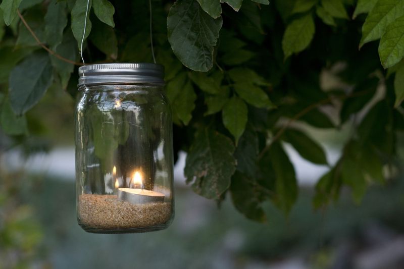 mason-jar-candle-hanging-on-tree | backyard diy projects