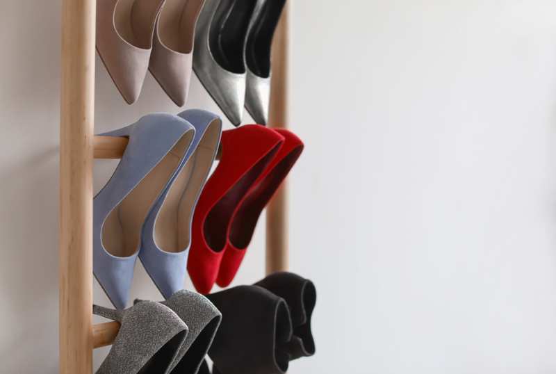rack high heeled shoes on light | shoe rack