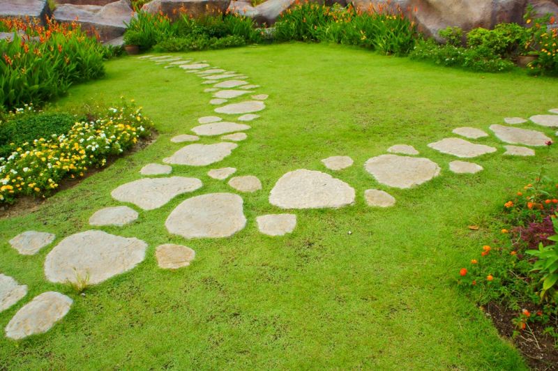 stone-walkway-winding-garden | cheap backyard landscaping ideas