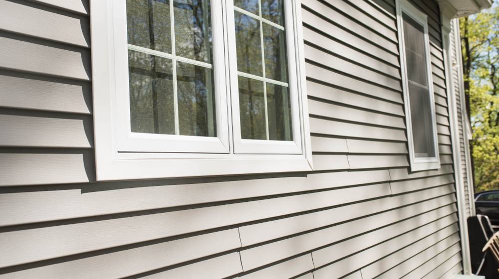 vinyl-siding-on-house-window-frames | A Comprehensive Guide To Vinyl Siding Repair | Featured