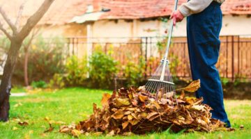 man raking leaves | Fall Home Maintenance Checklist: How To Prepare Your Home For Fall | fall maintenance checklist |