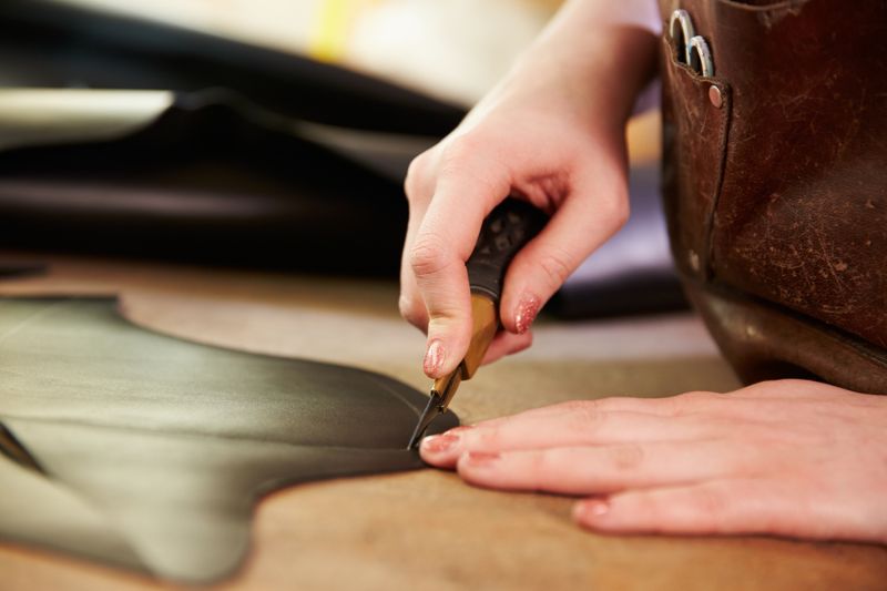 shoemaker-cutting-leather-workshop-close | leather craft