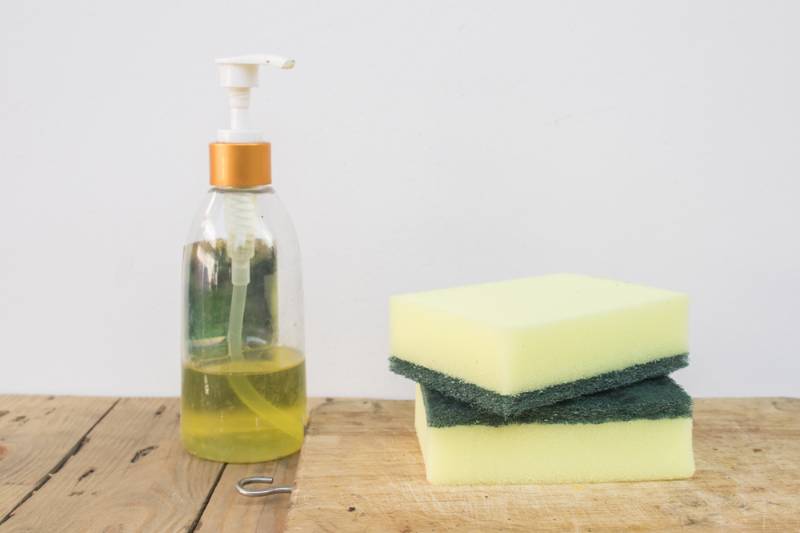 sponge-dish-washing-liquid-on-wood | DIY Makeup Brush Cleaner To Effectively Disinfect Your Brushes