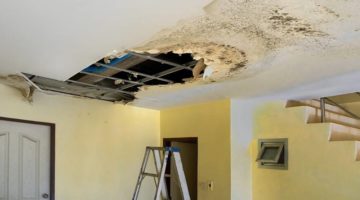water-leak-leaks-down-rooftop-floor | A Beginner's Guide To Ceiling Repair | Featured