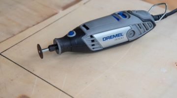 Multitool-on-a-wooden-board-used-for-craft-project | Which Dremel Tool Is Right For You? | Featured