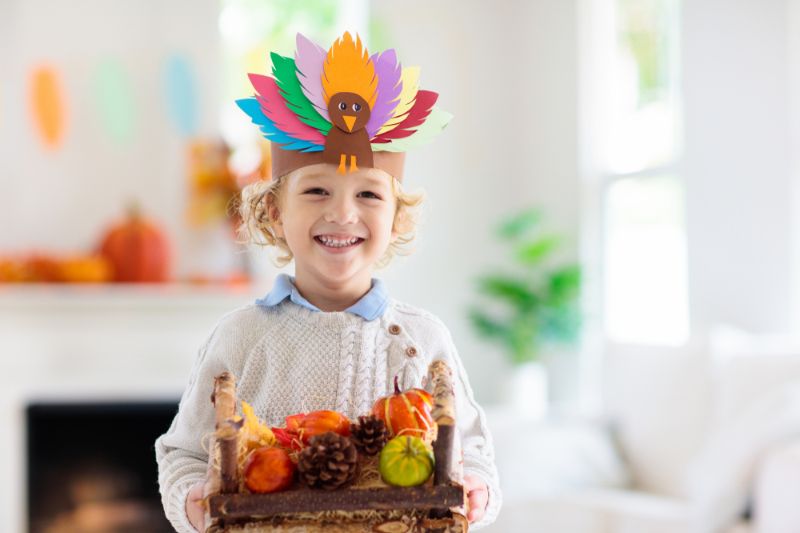  thanksgiving art projects for elementary students | child-celebrating-thanksgiving-kid-holding-pumpkin 