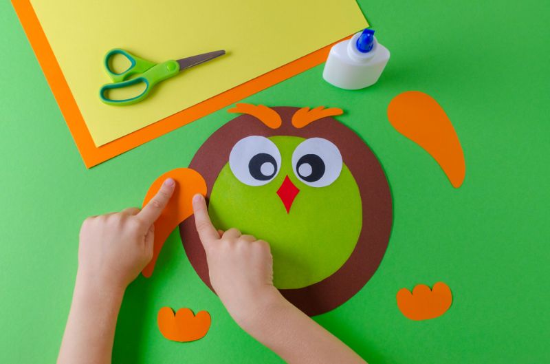  thanksgiving crafts for kids | kid-making-owl-color-paper-glue 
