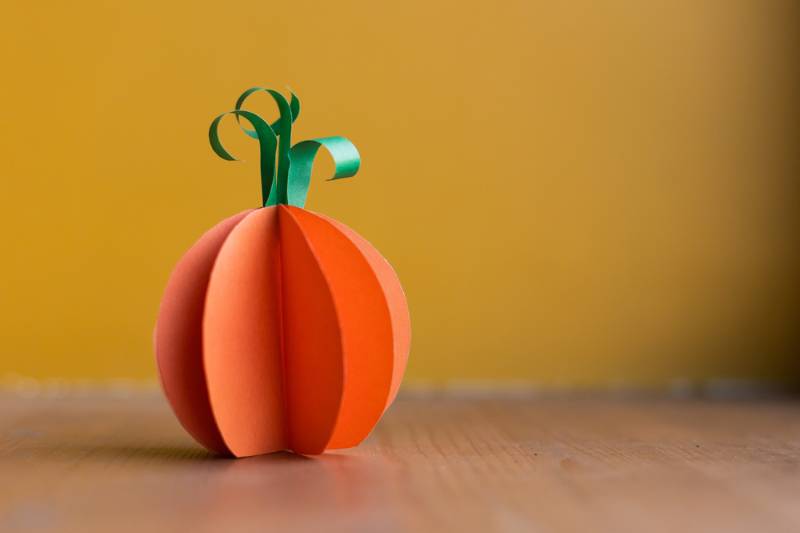 paper orange pumpkin on yellow background | easy paper pumpkin crafts
