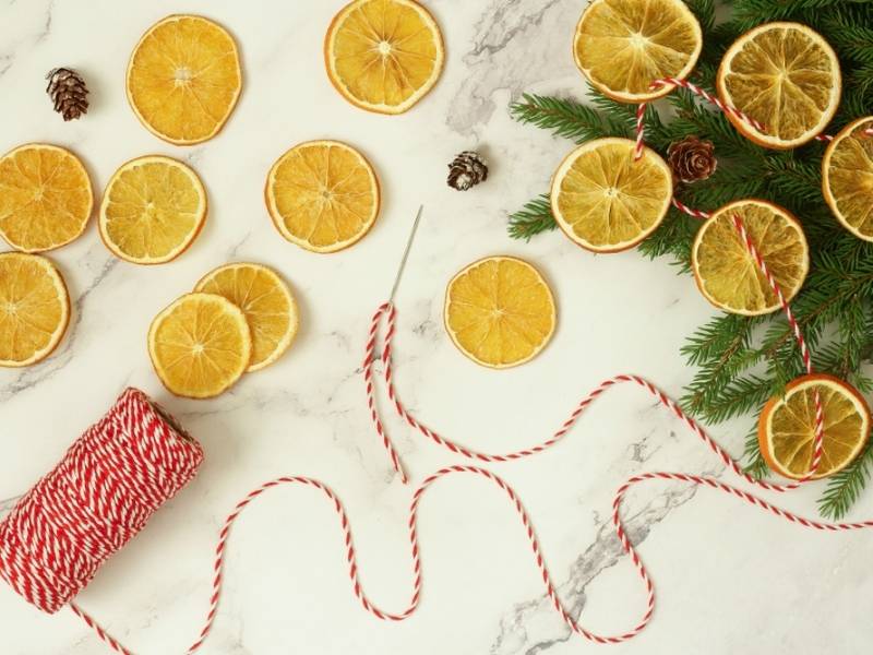 making-christmas-decoration-garland-dry-orange | artificial christmas garland