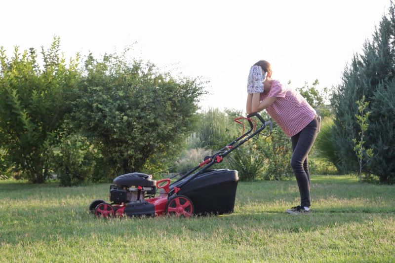 tired-woman-making-short-break-while | lawn mower