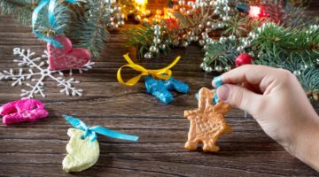 child-holds-garland-christmas-decorations-salt | DIY Salt Dough Ornaments | Featured