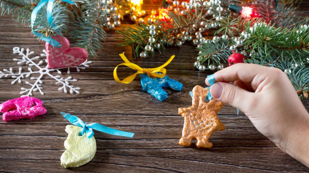 child-holds-garland-christmas-decorations-salt | DIY Salt Dough Ornaments | Featured